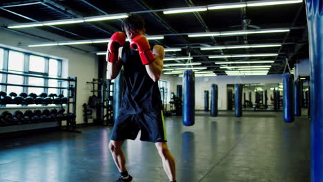 man boxing in gym