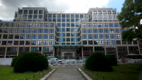 front view of a modern office building with a glass facade in berlin's business district