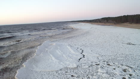 dramatic low altitude drone flight above frozen sea