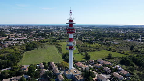 radio tower juxtaposed with natural and urban scenes.