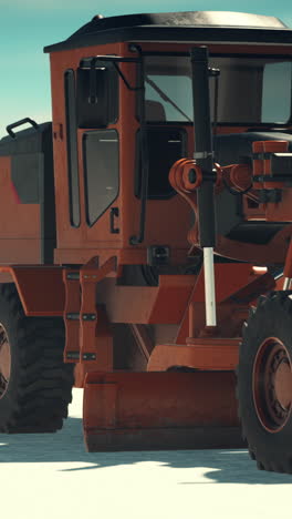 close-up of an orange road grader