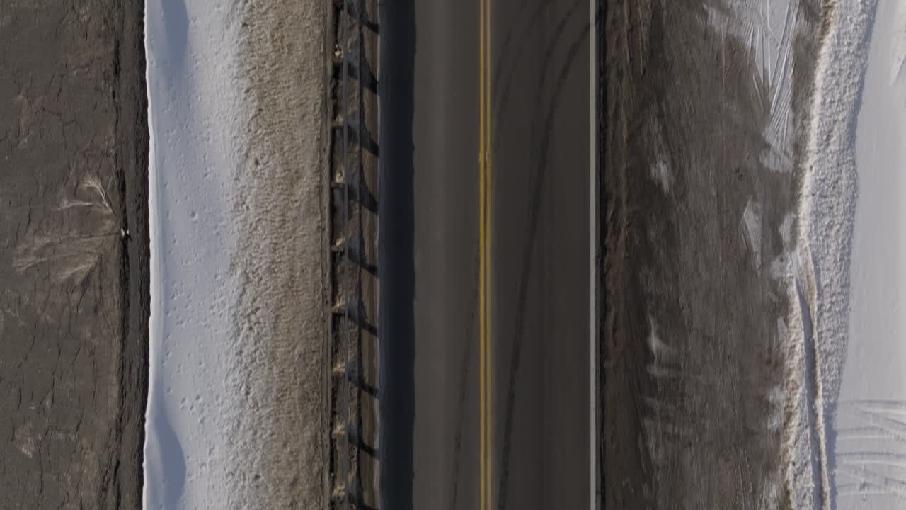 Aerial shot of an empty mountian road