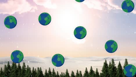 animation of globes falling over winter mountain landscape