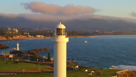 flagstaff point lighthouse in wollongong, sydney, new south wales, australia - aerial pullback