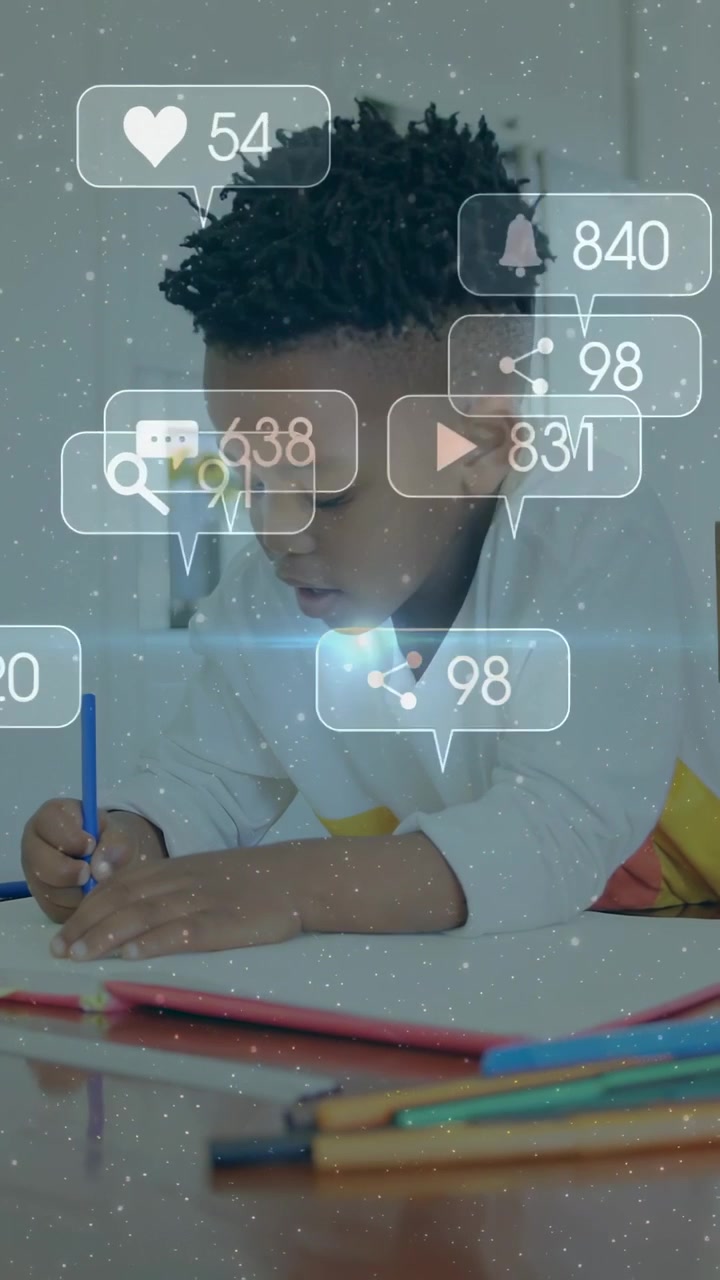 Sitting boy focusing on drawing at table, notebook, colored-pencils, social-media icons, lens flare