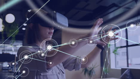 Animation of network of connections over asian businesswoman using vr headset