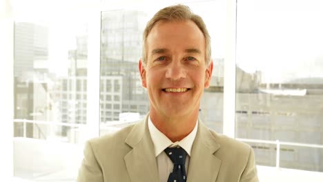 businessman looking at camera with arms crossed