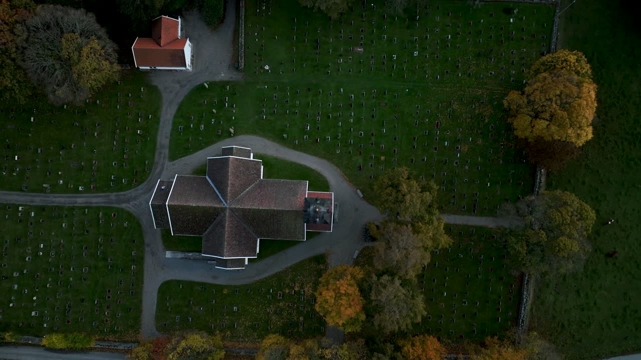 Drone glides over church surrounded by nature’s autumnal golden hues