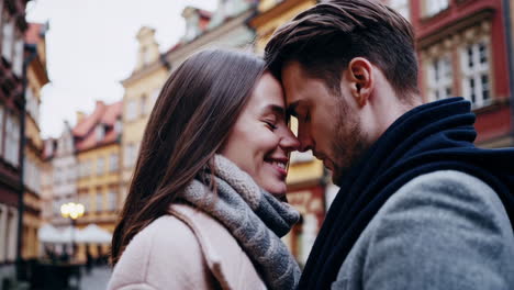 a romantic moment between a couple in a city street