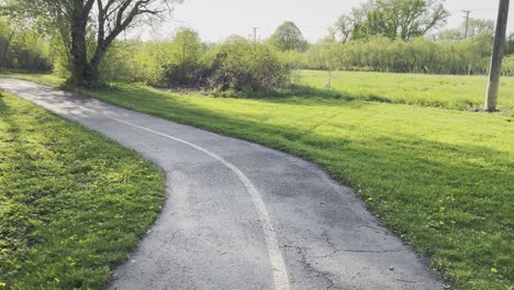 rolling across a bike trail bridge in the summer