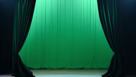 a stage with green curtains