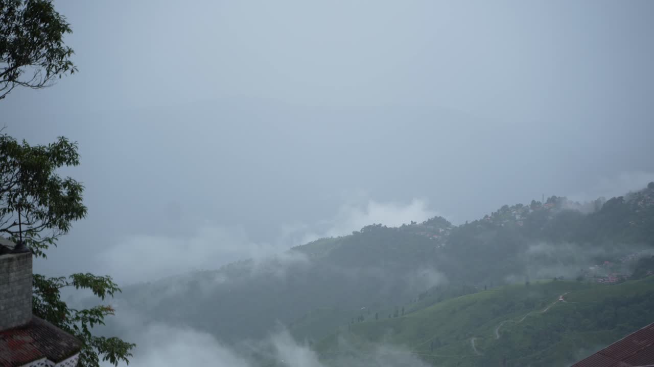 The mountain is covered in clouds during the rainy season