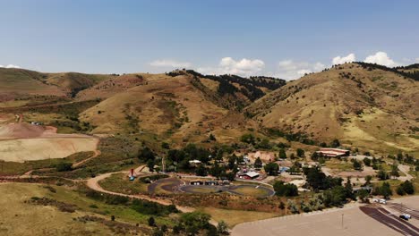 A-drone-shot-showing-an-abandoned-amusement-park,-golden-co