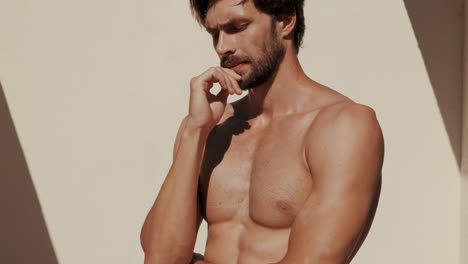 shirtless man portrait outdoors