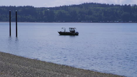 small, nondescript fishing floating near dock at camano island state park, wa state 20sec-60fps version 5