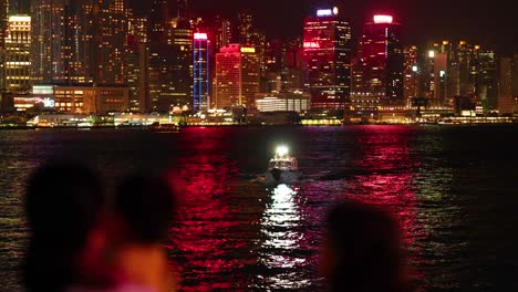 colorful light show over hong kong's iconic skyline