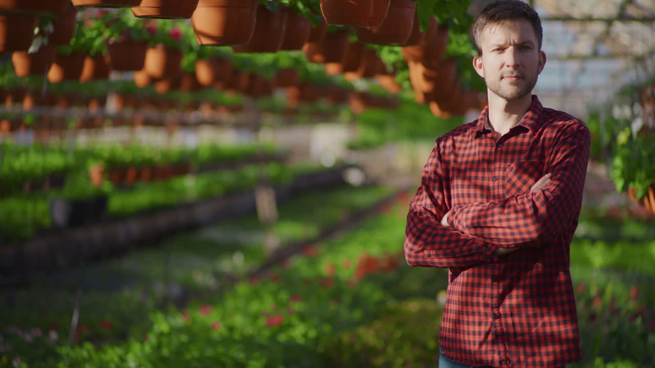 Proud Gardener in Greenhouse