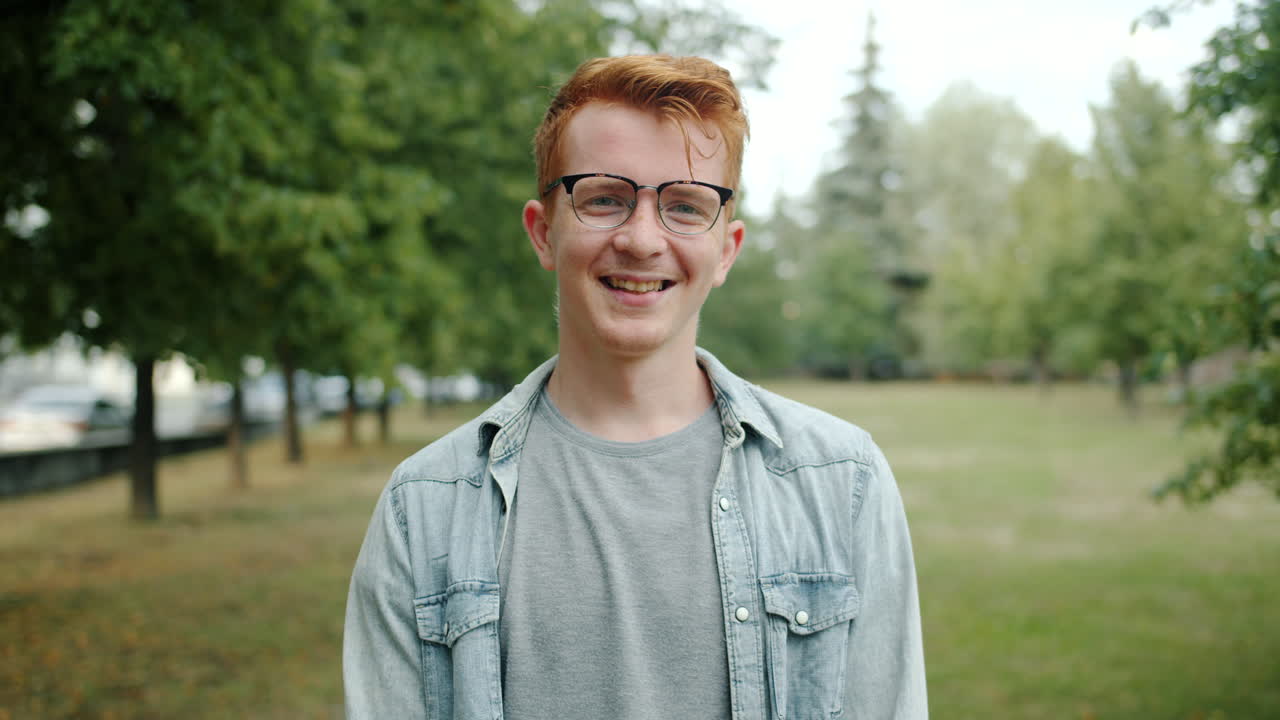 Young Man Smiling in a Park