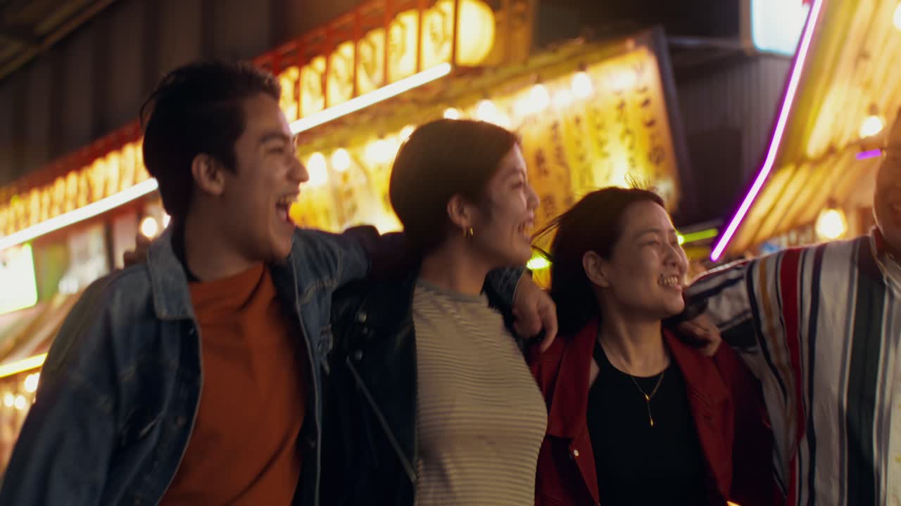 Friends Enjoying a Night Out in a Japanese City