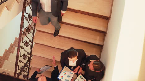 top view of businesswomen discussing on staircase