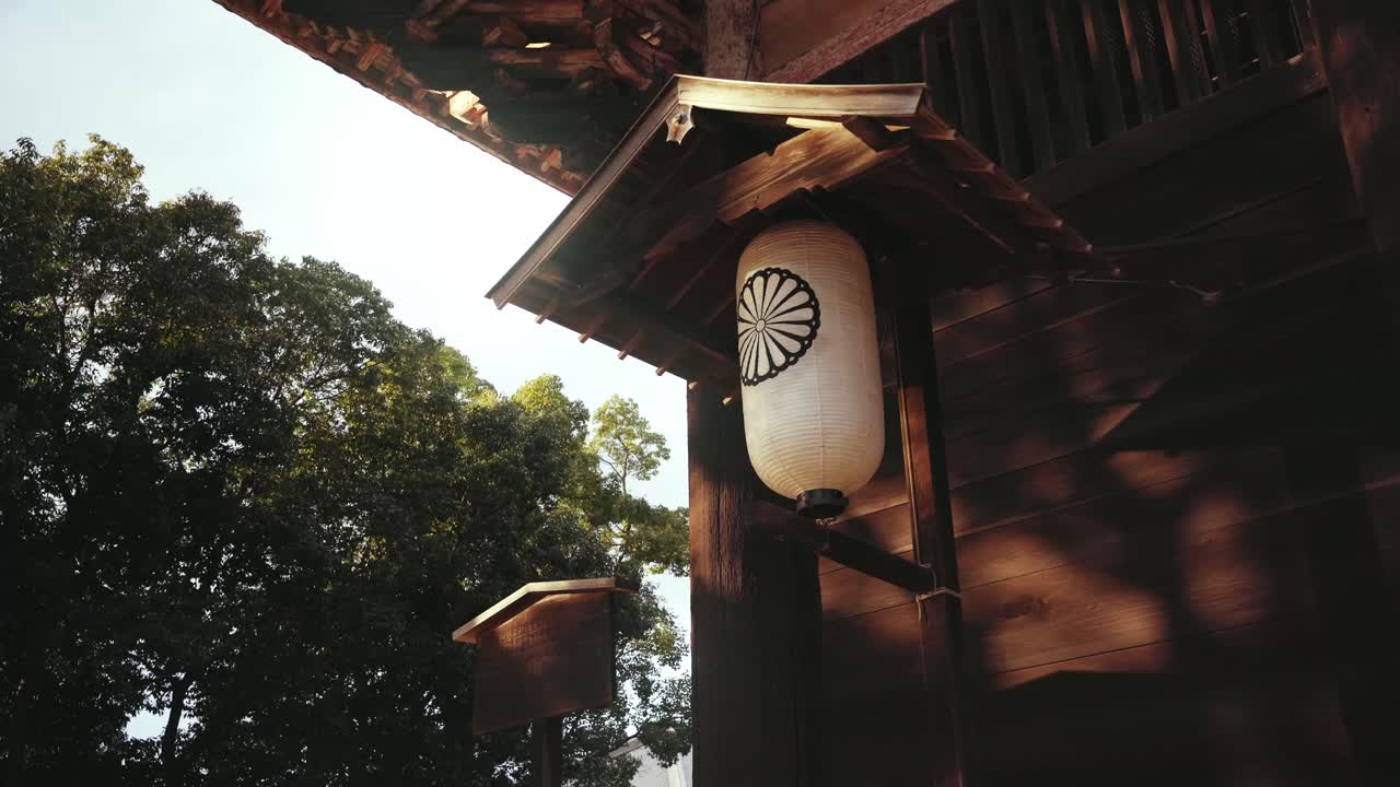 A big paper lantern swaying in the breeze at Nandaimon near Tōdai-ji Temple in Nara, Japan. Golden Hour