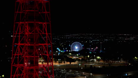 tv tower with amusement park in the background