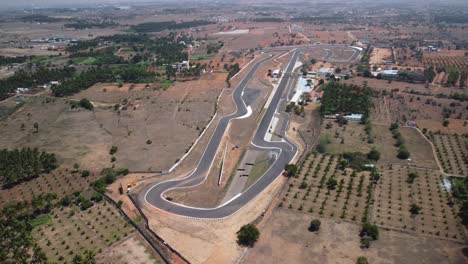 Panoramic-aerial-view-of-Kari-Motor-Speedway-Racetrack-in-Chettipalayam,-Coimbatore,-Tamil-Nadu,-India