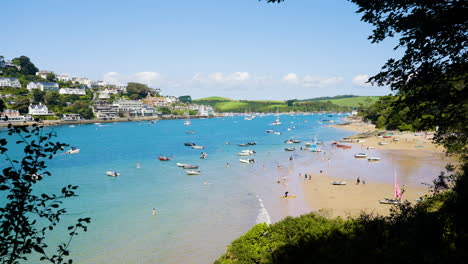 coastal bay scene with boats and people
