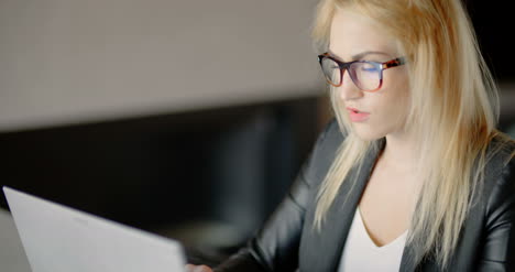 angry young woman working until late evening in office 1