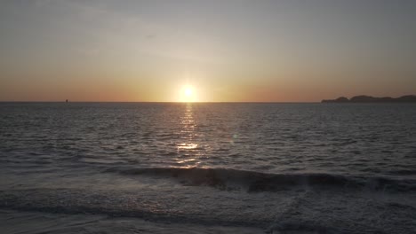 slow motion of pacific ocean waves on beach with sunset sunlight, san francisco bay, california usa
