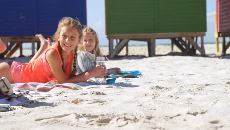 siblings relaxing together in the beach 4k