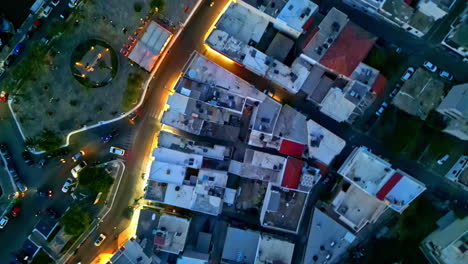 elounda port gulf of korfos, crete greece aerial at night over buildings