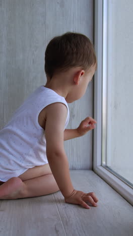 baby looking out the window