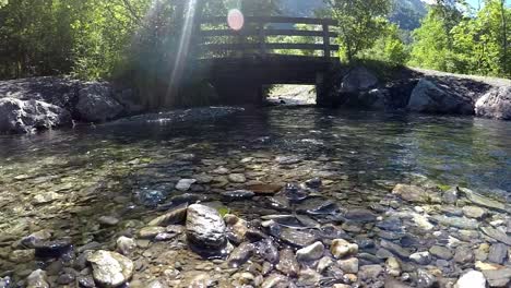 a stream that flows under a bridge