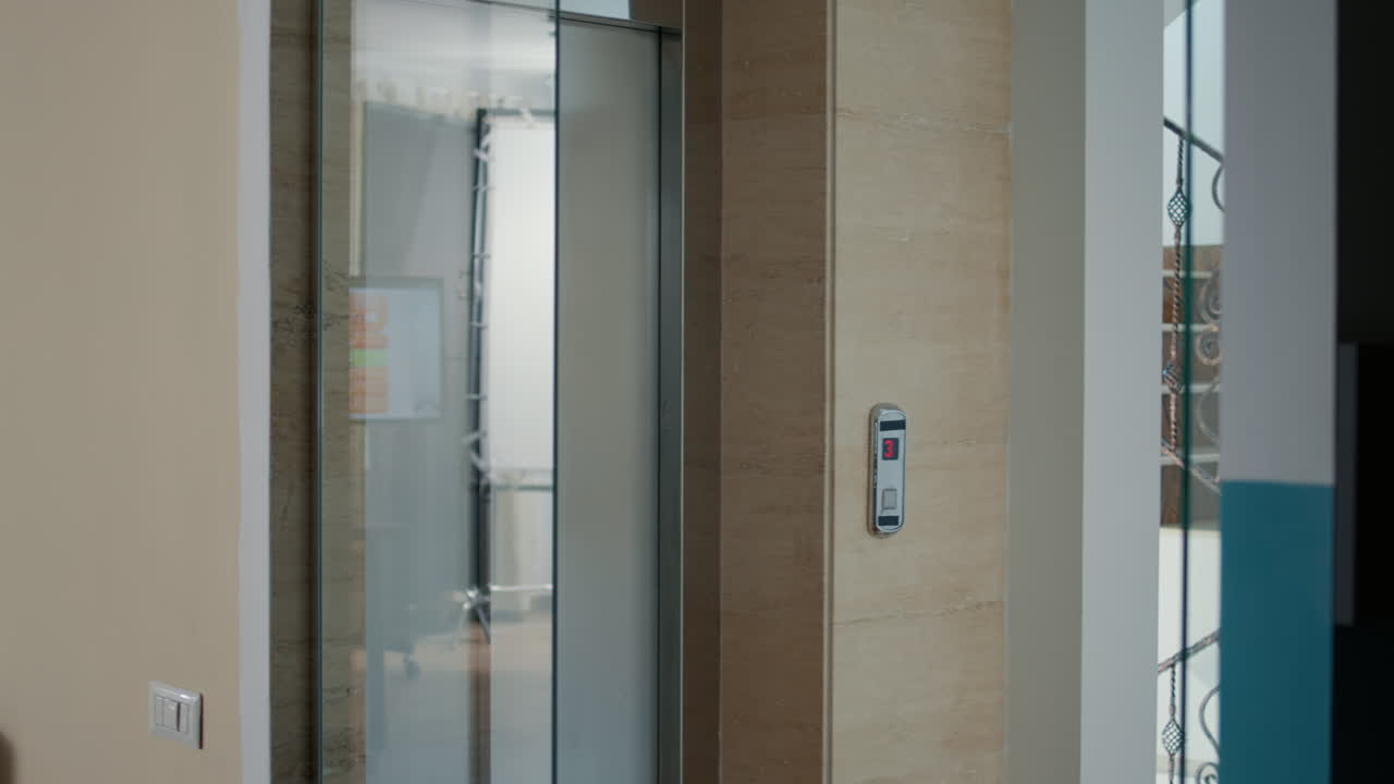 Company employee leaving work but starting to run when disgusting brain-eating monsters come out of elevator