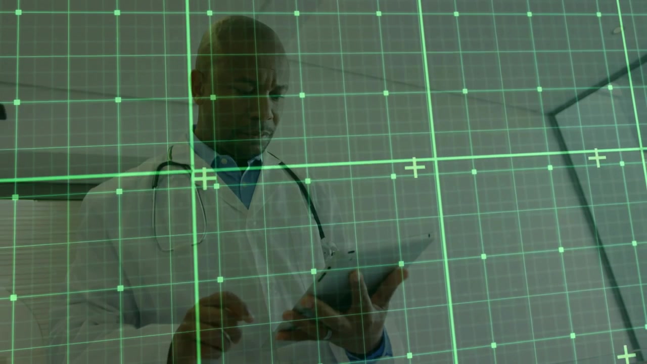 Male doctor raising tablet, swiping screen in clinic for reviewing medical data with grid overlay