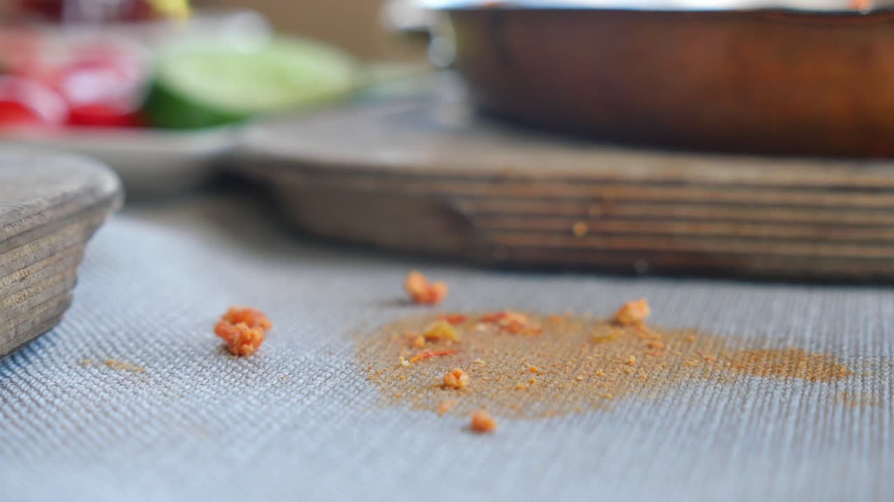 Close-up of Food Crumbs and Spill on a Tablecloth