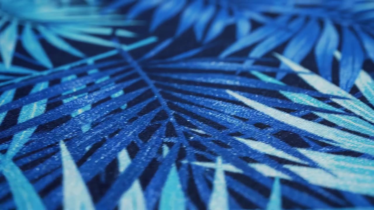 Macro Shot of Blue Tropical Palm Leaf Patterned Fabric