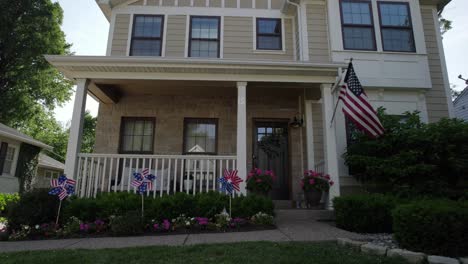 Pull-back-from-patriotic-decoration-in-front-of-a-nice-house