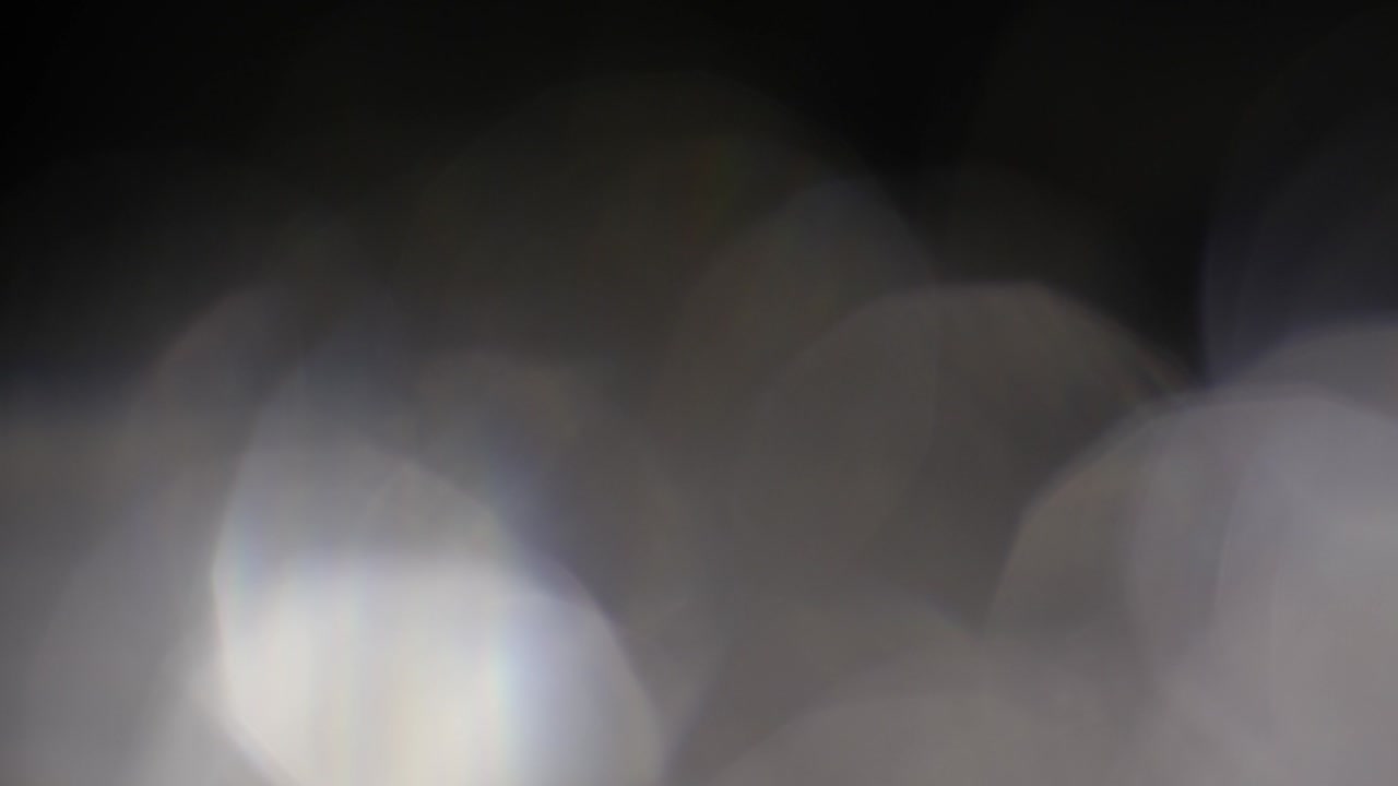 Abstract Silver colored bokeh, defocus round, circle on black background