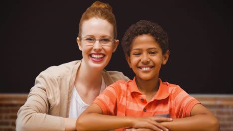 animation of smiling caucasian female teacher and african american schoolboy over board