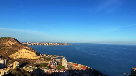 Above-view-of-Alicante-city-in-Spain-and-the-Balearic-Sea-during-the-day-4K-30-FPS