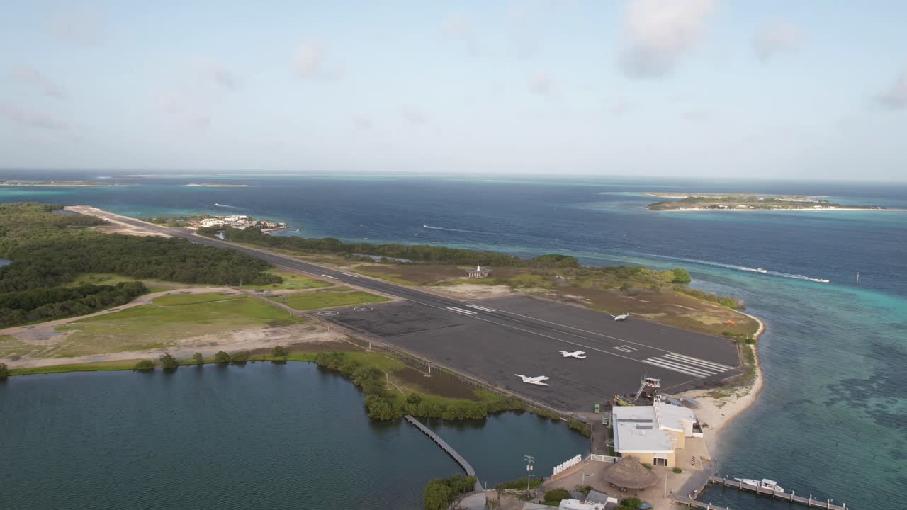 Aerial view of Venezuelan coastal airport with sea and land contrast
