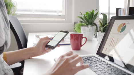 close up of business woman hands  using digital tablet touchscreen phone looking at finance data graphs planning responsible global solution