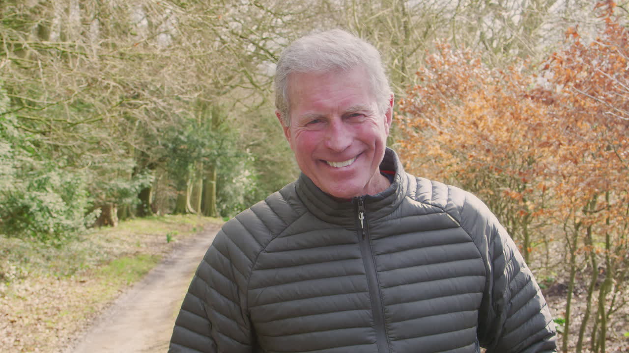 Portrait Of Senior Man On Walk In Countryside Exercising During Covid 19 Lockdown