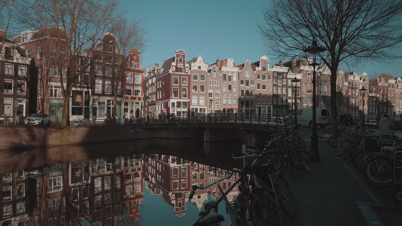 Amsterdam Canal with Bikes and Reflections