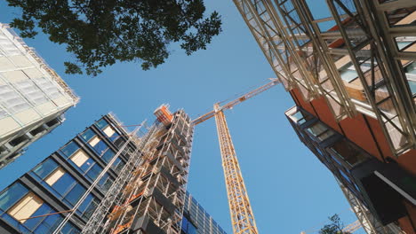 the building is surrounded by glass office buildings building and reconstruction in the downtown of