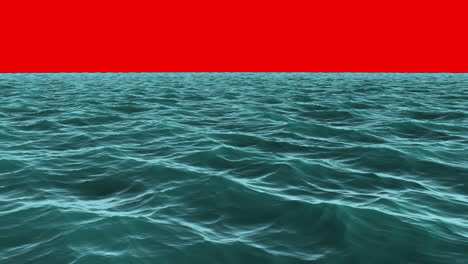 Choppy blue ocean under red screen sky 