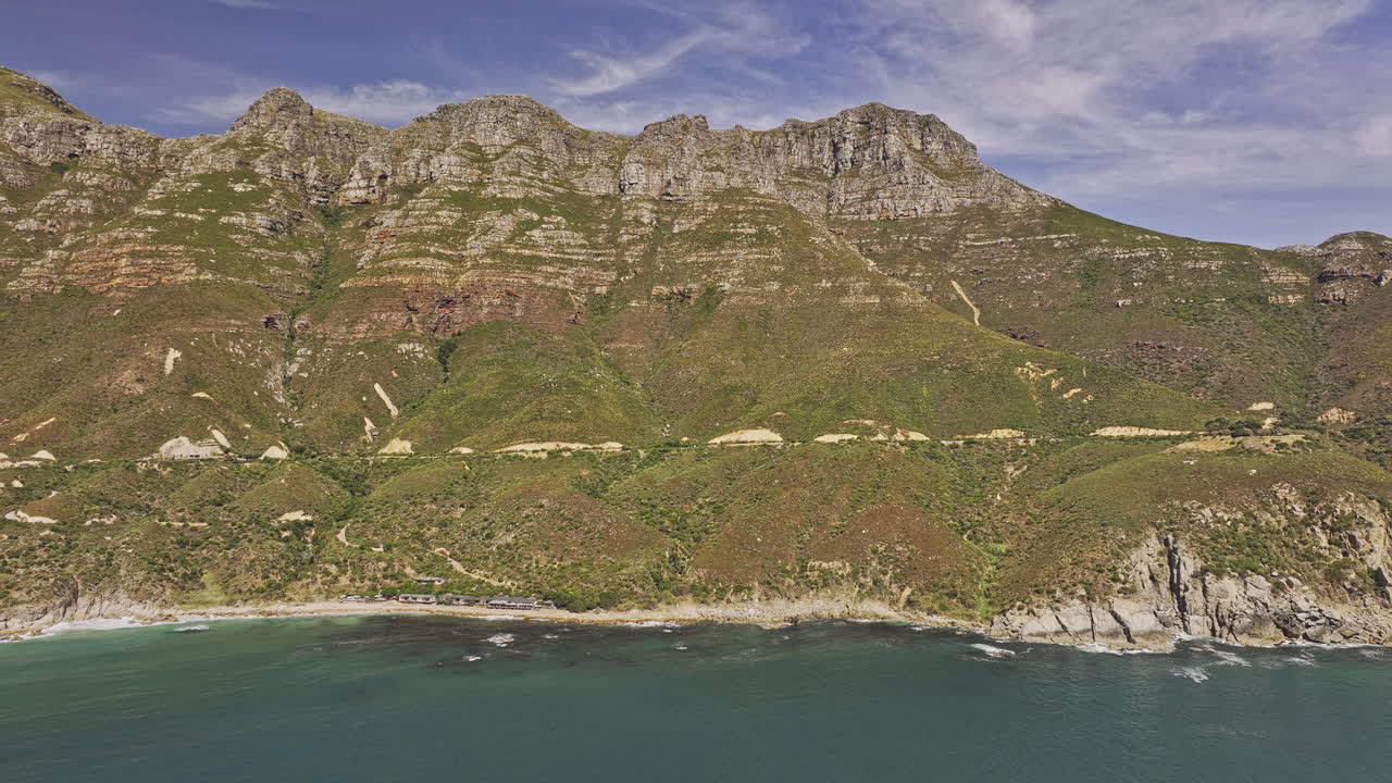 Cape Town South Africa Aerial v95 flyover Hout Bay capturing Chapman's Peak drive winds along steep cliffs capturing coastal beauty and mountain landscape - Shot with Mavic 3 Pro Cine - Jan 11th 2024