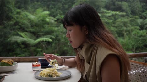 Spaghetti meal, hungry young woman, delicious pasta dinner, close-up